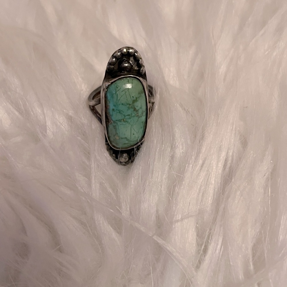 Turquoise ring. Size 3. Kind like a pinky ring.